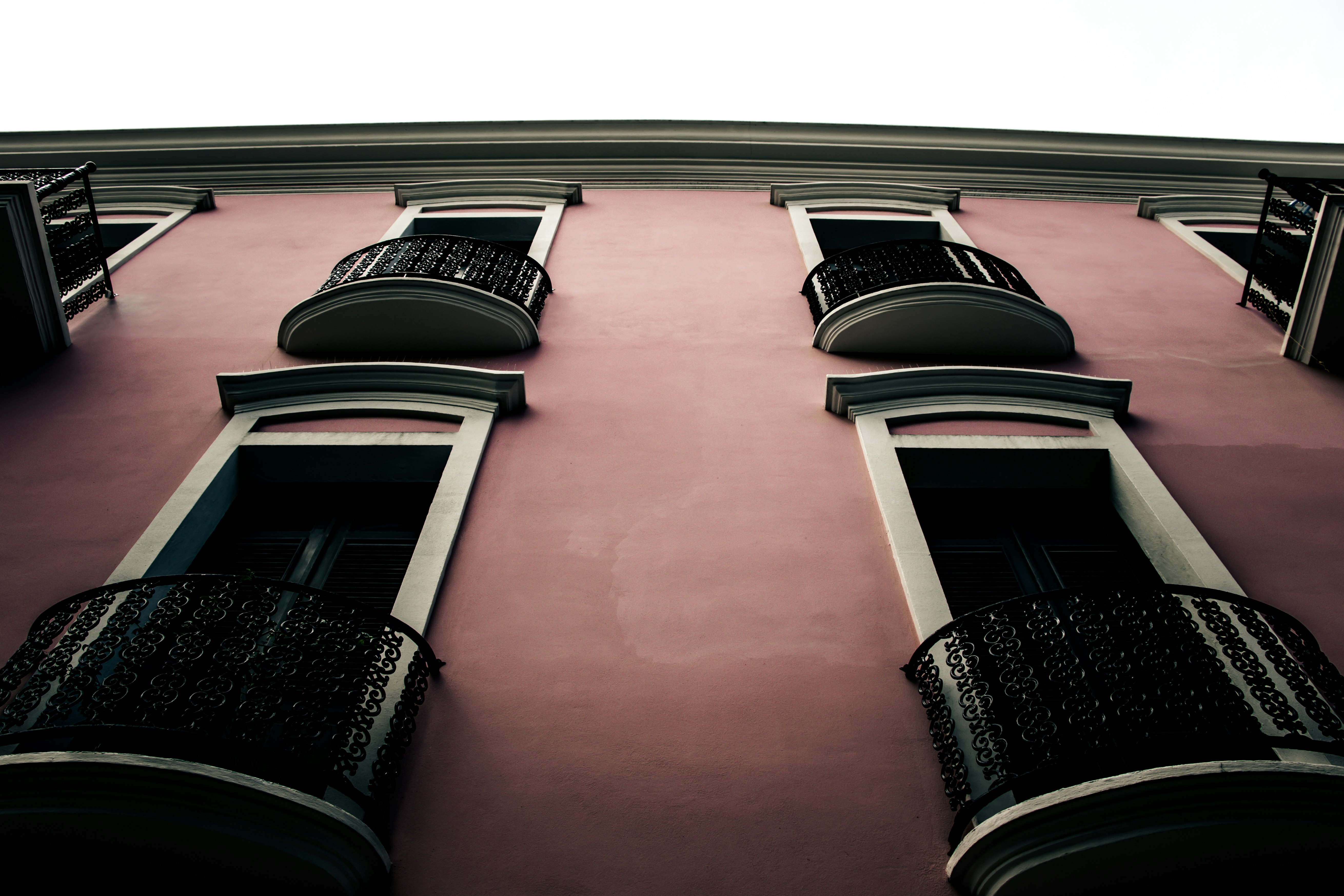 pink and white concrete building at daytime